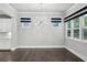 Bright dining room features hardwood floors, modern light fixture, and stylish window valances at 614 Denali Dr, Mableton, GA 30126