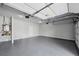 Clean, spacious garage with epoxy flooring and modern door openers at 614 Denali Dr, Mableton, GA 30126