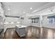 Open-concept kitchen with island, stainless appliances, custom cabinets, and hardwood flooring at 614 Denali Dr, Mableton, GA 30126