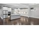 Spacious open-concept kitchen with island, stainless appliances, and dark hardwood flooring at 614 Denali Dr, Mableton, GA 30126