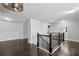 Upper landing with hardwood floors and decorative lighting at 614 Denali Dr, Mableton, GA 30126