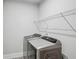 Laundry room features modern washer and dryer at 614 Denali Dr, Mableton, GA 30126