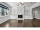 Spacious living room features hardwood floors, a fireplace, and custom built-in shelving at 614 Denali Dr, Mableton, GA 30126
