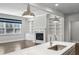 An open concept living room and kitchen, with hardwood flooring, cabinets, and fireplace at 614 Denali Dr, Mableton, GA 30126