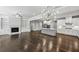 Open floor plan with hardwood floors and a fireplace that connects the living room and kitchen at 614 Denali Dr, Mableton, GA 30126