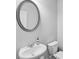 Powder room featuring a large mirror and pedestal sink at 614 Denali Dr, Mableton, GA 30126