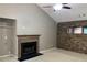 Bright living room with fireplace and stone accent wall, creating a cozy and stylish gathering space at 5415 Windcrest Ln, Suwanee, GA 30024