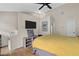 Bright bedroom featuring a vaulted ceiling, ceiling fan, television, and stylish decor, creating a comfortable and inviting retreat at 1154 Village Se Ct, Atlanta, GA 30316