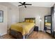 Spacious bedroom featuring a comfortable bed, ceiling fan, and stylish decor, creating a relaxing and inviting retreat at 1154 Village Se Ct, Atlanta, GA 30316