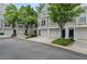Charming townhome exteriors featuring attached garages and manicured landscaping at 1154 Village Se Ct, Atlanta, GA 30316