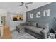 A comfortable living room with a gray sofa and a view to the kitchen at 1154 Village Se Ct, Atlanta, GA 30316