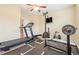 Home gym equipped with a treadmill, weightlifting machine, and rubber flooring for a complete workout experience at 1527 Sage Ridge Dr, Marietta, GA 30064