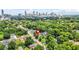 Expansive aerial view of property showcasing lush greenery and the city skyline as a backdrop at 556 Paines Nw Ave, Atlanta, GA 30318
