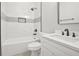 This bathroom features a white shower and vanity, and black fixtures at 556 Paines Nw Ave, Atlanta, GA 30318