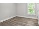 Bright bedroom featuring wood floors, natural light, and neutral paint at 556 Paines Nw Ave, Atlanta, GA 30318