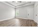 Spacious bedroom with tray ceiling, neutral tones, and natural light from the window at 556 Paines Nw Ave, Atlanta, GA 30318