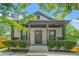 Charming home with mature trees and a covered front porch, perfect for enjoying the outdoors at 556 Paines Nw Ave, Atlanta, GA 30318