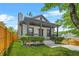 Beautiful home featuring a covered front porch, lush landscaping, and a welcoming entrance at 556 Paines Nw Ave, Atlanta, GA 30318
