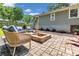 Backyard featuring a brick firepit with outdoor seating, landscaping, grass, and a privacy fence at 111 Marona Street Ne Ne St, Atlanta, GA 30307