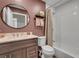 Bathroom features a modern vanity, round mirror, and shower with white tile surround at 111 Marona Street Ne Ne St, Atlanta, GA 30307