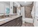 Bathroom with granite countertops, double vanity, tiled shower, and decorative mirror at 111 Marona Street Ne Ne St, Atlanta, GA 30307