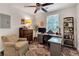 Bedroom features a large desk, comfortable chair, ceiling fan and good natural lighting at 111 Marona Street Ne Ne St, Atlanta, GA 30307
