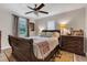 Comfortable bedroom featuring a ceiling fan, a window with natural light, and classic furnishings at 111 Marona Street Ne Ne St, Atlanta, GA 30307