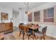 Dining room features wood table, six chairs, decorative lighting, and three large art pieces at 111 Marona Street Ne Ne St, Atlanta, GA 30307
