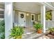 View of a covered front porch with hanging swing, plants, and room for seating at 111 Marona Street Ne Ne St, Atlanta, GA 30307