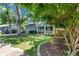 Charming single-story home with a well-manicured lawn and inviting front porch, complemented by mature trees at 111 Marona Street Ne Ne St, Atlanta, GA 30307