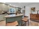 Beautiful kitchen with island, bar stool seating, stainless appliances, and light green cabinets at 111 Marona Street Ne Ne St, Atlanta, GA 30307