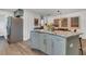Kitchen island with breakfast bar seating and stainless fridge in an open floor plan at 111 Marona Street Ne Ne St, Atlanta, GA 30307