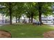 A grassy city park in downtown Cartersville offers shade trees, benches, and leisure at 504 Regency Trl, Acworth, GA 30102
