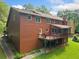 Spacious backyard with a deck ideal for outdoor dining and relaxing at 3436 Laurelwood Ne Ct, Roswell, GA 30075