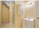 Compact bathroom with vanity, mirror, and tiled shower in a neutral color palette at 3436 Laurelwood Ne Ct, Roswell, GA 30075