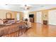 Spacious main bedroom with wooden floors, a decorative ceiling fan and seating area at 3436 Laurelwood Ne Ct, Roswell, GA 30075