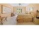 Inviting bedroom with large window, a cozy sitting chair, and decor at 3436 Laurelwood Ne Ct, Roswell, GA 30075