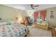 Comfortable bedroom with a charming quilt, cozy seating, and plenty of natural light at 3436 Laurelwood Ne Ct, Roswell, GA 30075