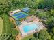 Aerial view of community amenities including pool, tennis courts, and play area at 3436 Laurelwood Ne Ct, Roswell, GA 30075