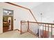 Open foyer with a staircase and modern lighting fixtures lead to the upstairs bedrooms at 3436 Laurelwood Ne Ct, Roswell, GA 30075