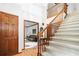 Grand foyer with staircase, hardwood floors, view of living room and door with access to other rooms at 3436 Laurelwood Ne Ct, Roswell, GA 30075
