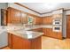 Kitchen with stainless steel appliances, granite countertops, and wood cabinets at 3436 Laurelwood Ne Ct, Roswell, GA 30075