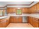 Kitchen with wood cabinets, stainless steel appliances, and granite countertops at 3436 Laurelwood Ne Ct, Roswell, GA 30075