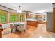Eat-in kitchen featuring stainless appliances, hardwood floors and table seating at 3436 Laurelwood Ne Ct, Roswell, GA 30075