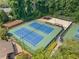 View of tennis courts, sand volleyball and manicured landscapes at 3436 Laurelwood Ne Ct, Roswell, GA 30075