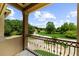 Enjoy the view from the balcony with wrought iron railings overlooking the landscaped grounds at 932 Shadowford Fls, Lithonia, GA 30058