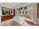 Bright bathroom showcases a soaking tub and arched shower with views of the outdoor scenery at 932 Shadowford Fls, Lithonia, GA 30058