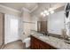Well-lit bathroom with a granite countertop vanity, a walk-in shower, and tile floors at 932 Shadowford Fls, Lithonia, GA 30058