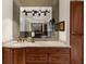 Bathroom vanity features a granite countertop and large mirror that expands the room's aesthetics at 932 Shadowford Fls, Lithonia, GA 30058