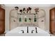 Bright bathroom showcases a soaking tub and arched shower with views of the outdoor scenery at 932 Shadowford Fls, Lithonia, GA 30058